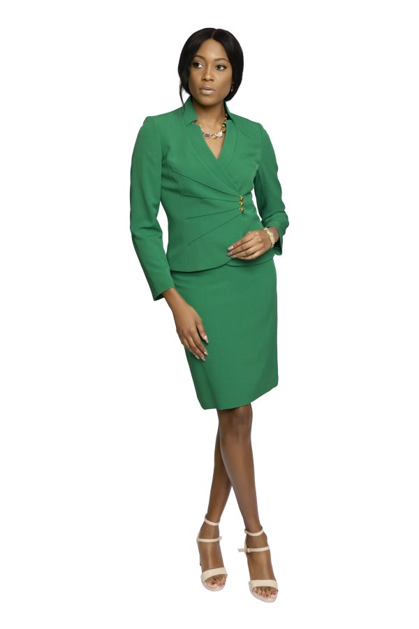 Tahari Kelly Green skirt suit, with asymmetrical jacket and gold buttons. Skirt with back slit
